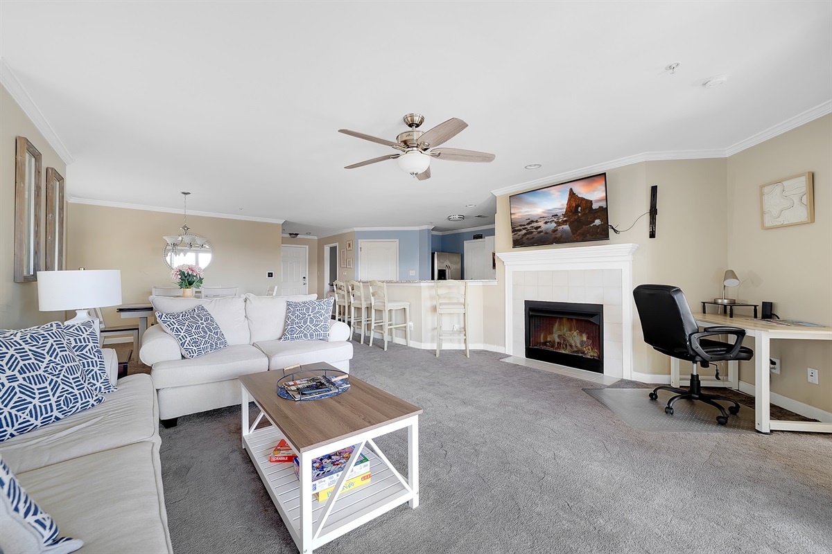 Living room features a desk for workspace