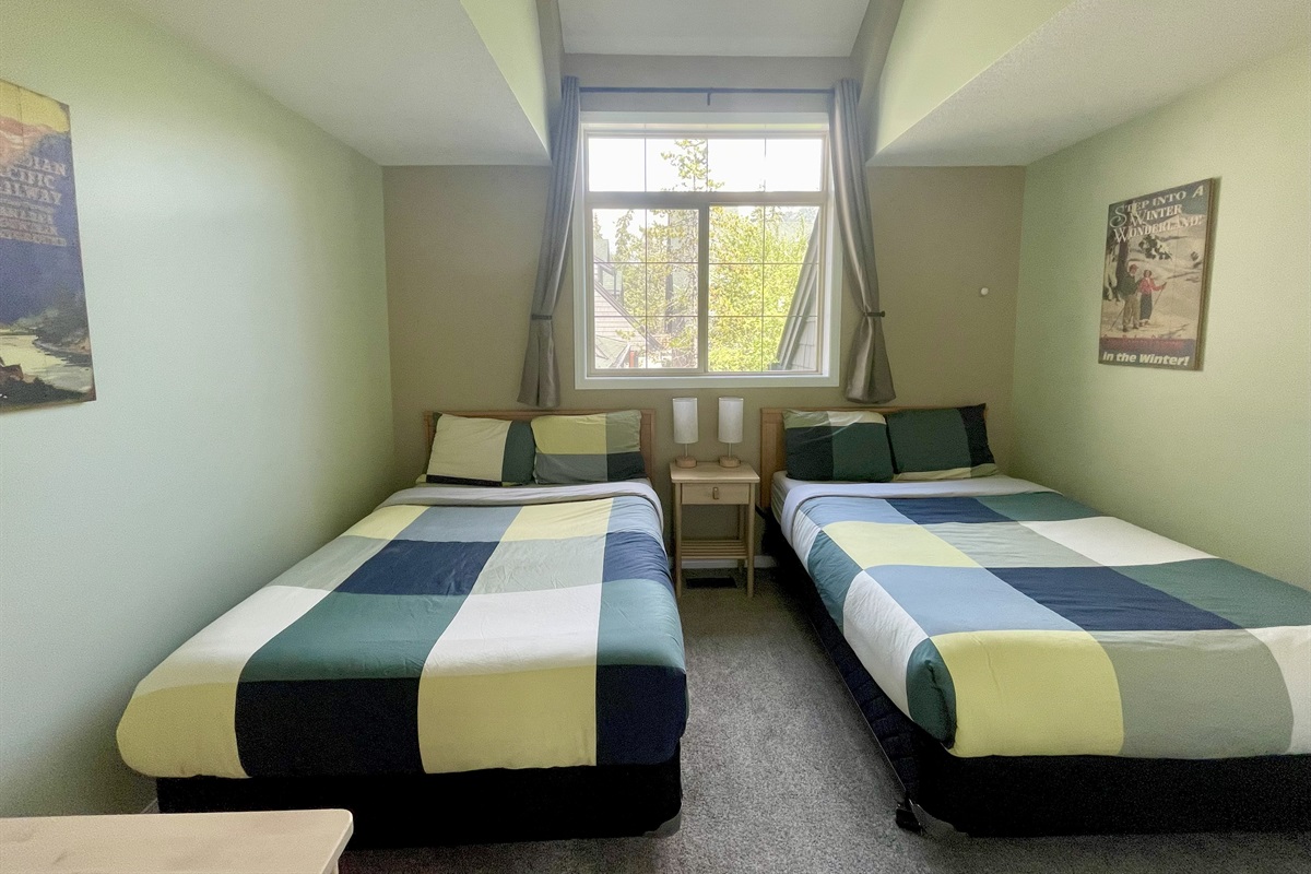 2nd bedroom.  Two double beds.  Adjacent bathroom in hallway.  Located on 2nd floor.