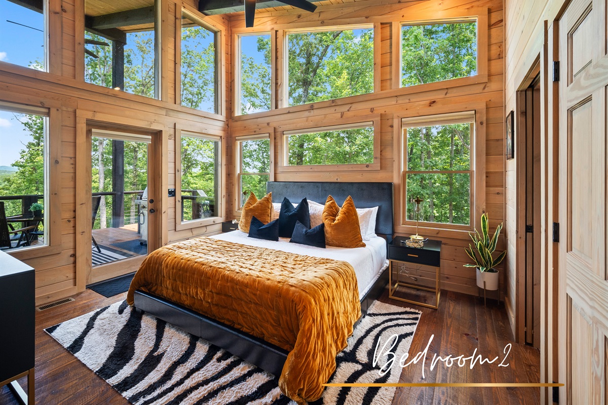 The second bedroom offers all the same luxuries as the primary suite. Style and sunbeams in every corner.