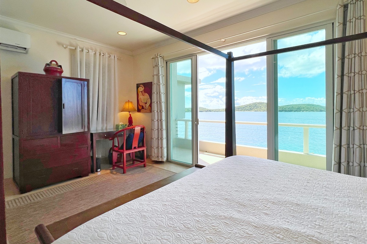 This king bedroom has ensuite access to the shared bathroom.