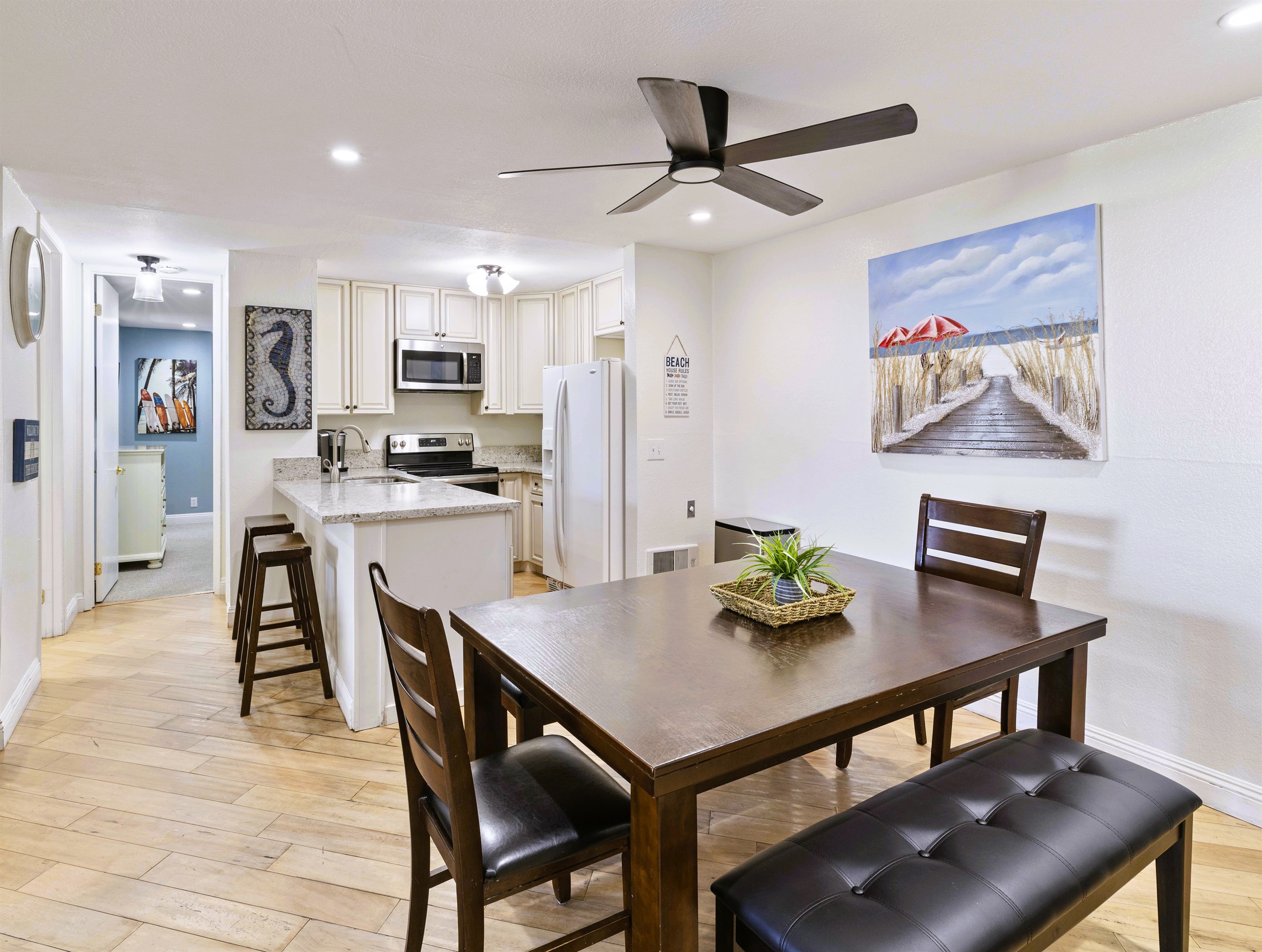 Kitchen and dining for six with stainless-steel appliances and Keurig coffee maker