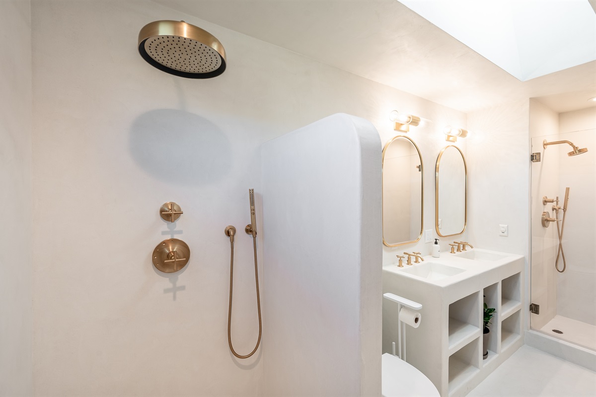 Moroccan (Tedelakt) plaster bathroom with Kohler fixtures, rain shower