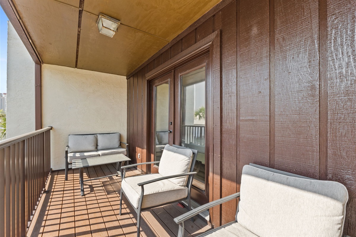 Balcony off of Bedroom 1 with outdoor seating
