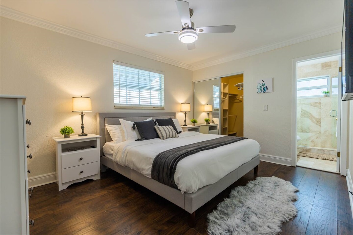 The 1st Bedroom has a King-sized bed, Smart App TV and large white dresser. It also has an en-suite bathroom with shower and new vanity. There is a great walk-in closet with a pack n play and sheets as well as inflatable mattress.