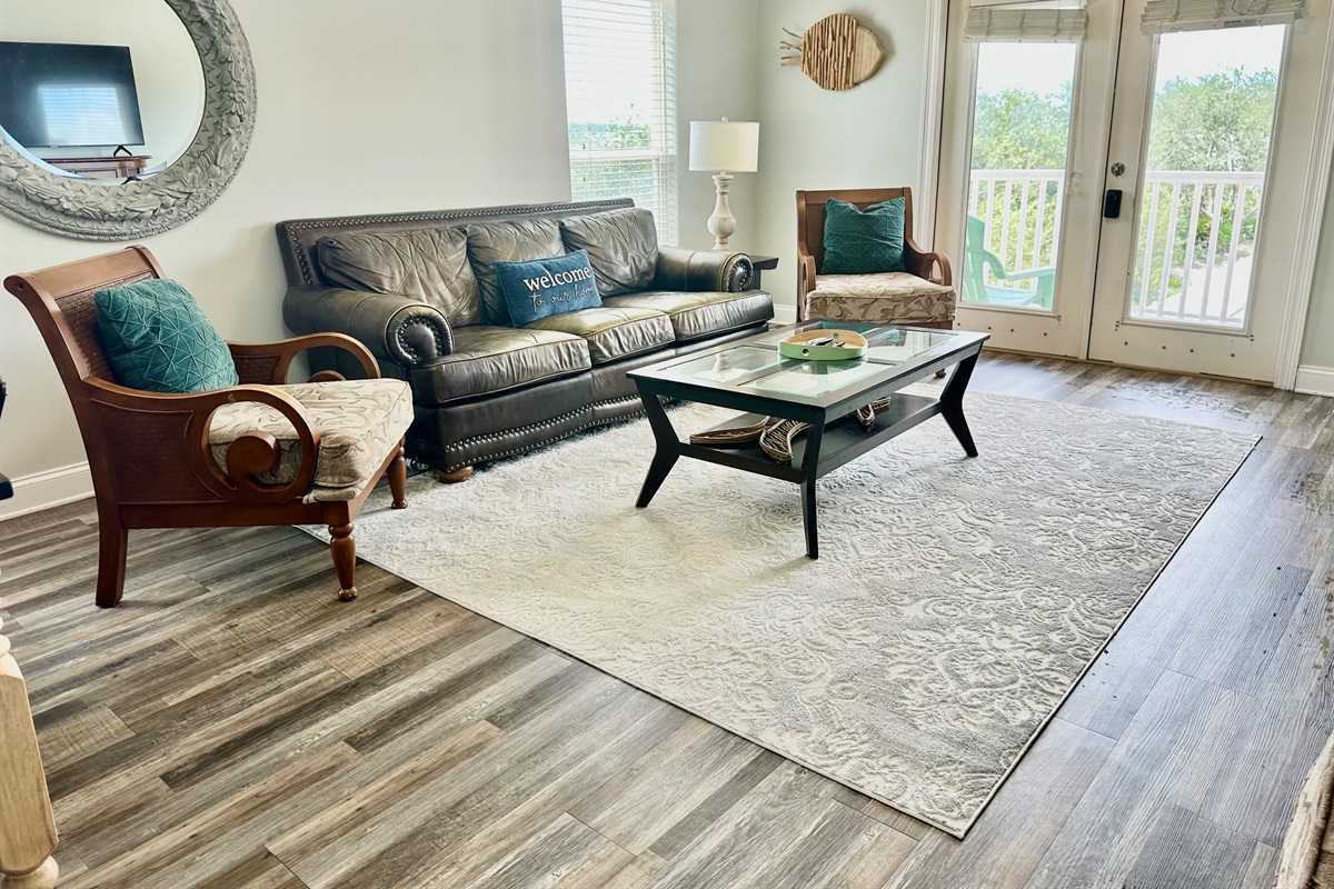 Living room with gorgeous lagoon views. (sofa isn't a sleeper)