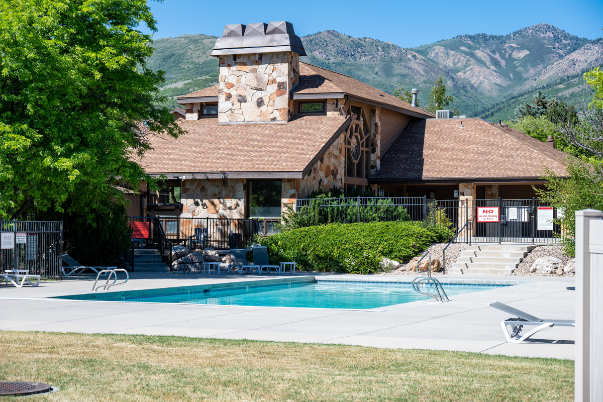Relax poolside at the community pool surrounded by beautiful mountain scenery.
