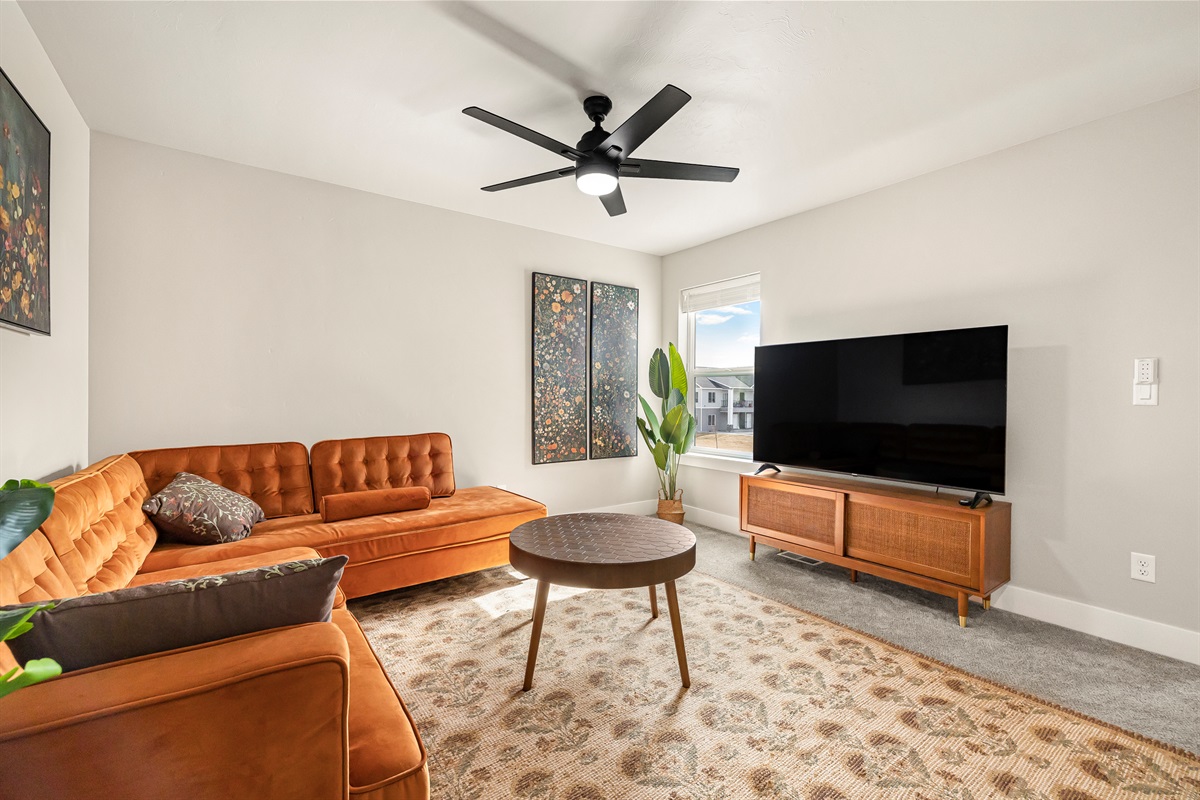 Upstairs living room with lots of natural light.