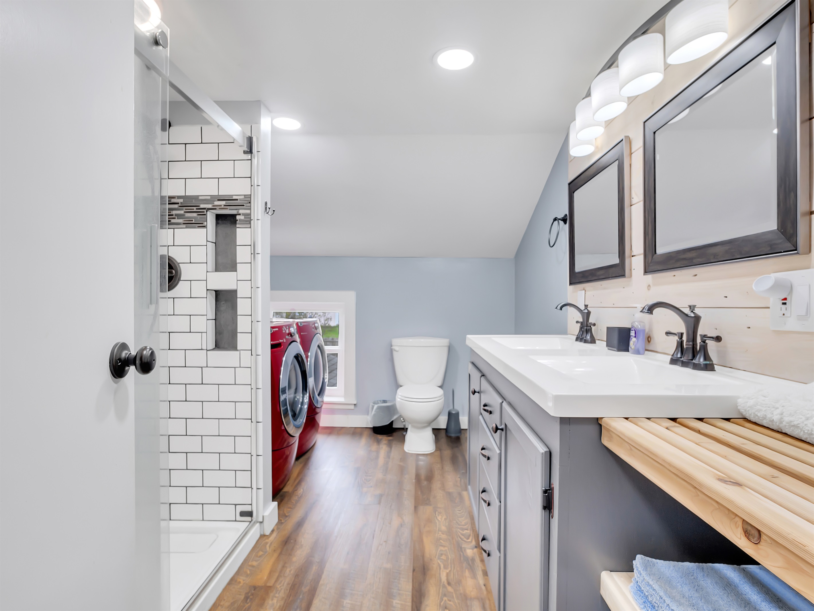 Bathroom with luxury shower and washer and dryer