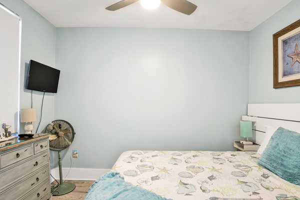 Guest bedroom with queen bed and inventive free-standing closet for storing personal items