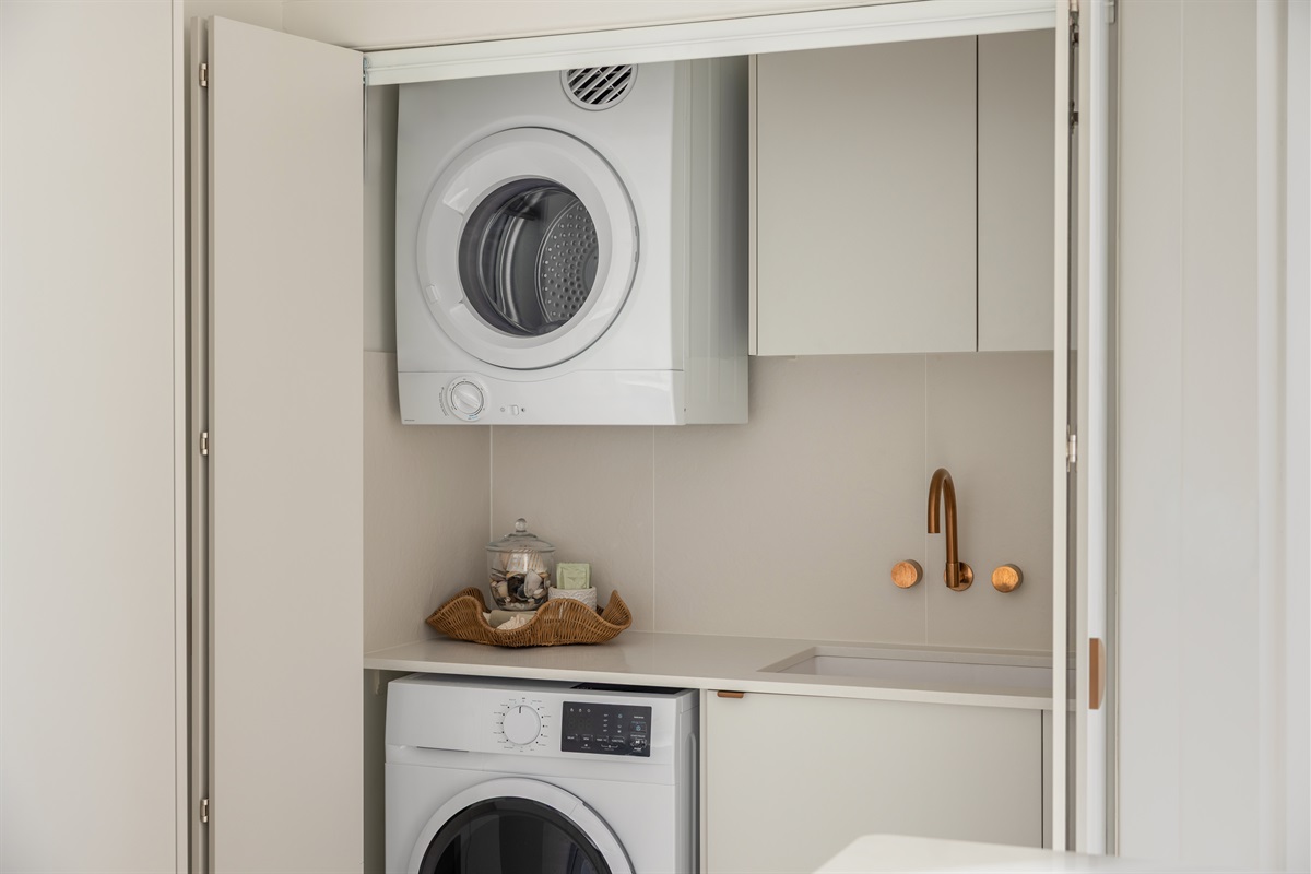 Hidden European-style laundry with washer & dryer for added convenience during your stay.
