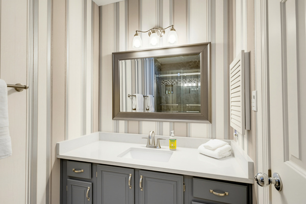 Thoughtful touches in every bathroom include plush Pottery Barn terry, Terra Pure bath amenities, and Mrs. Meyer’s hand soap.