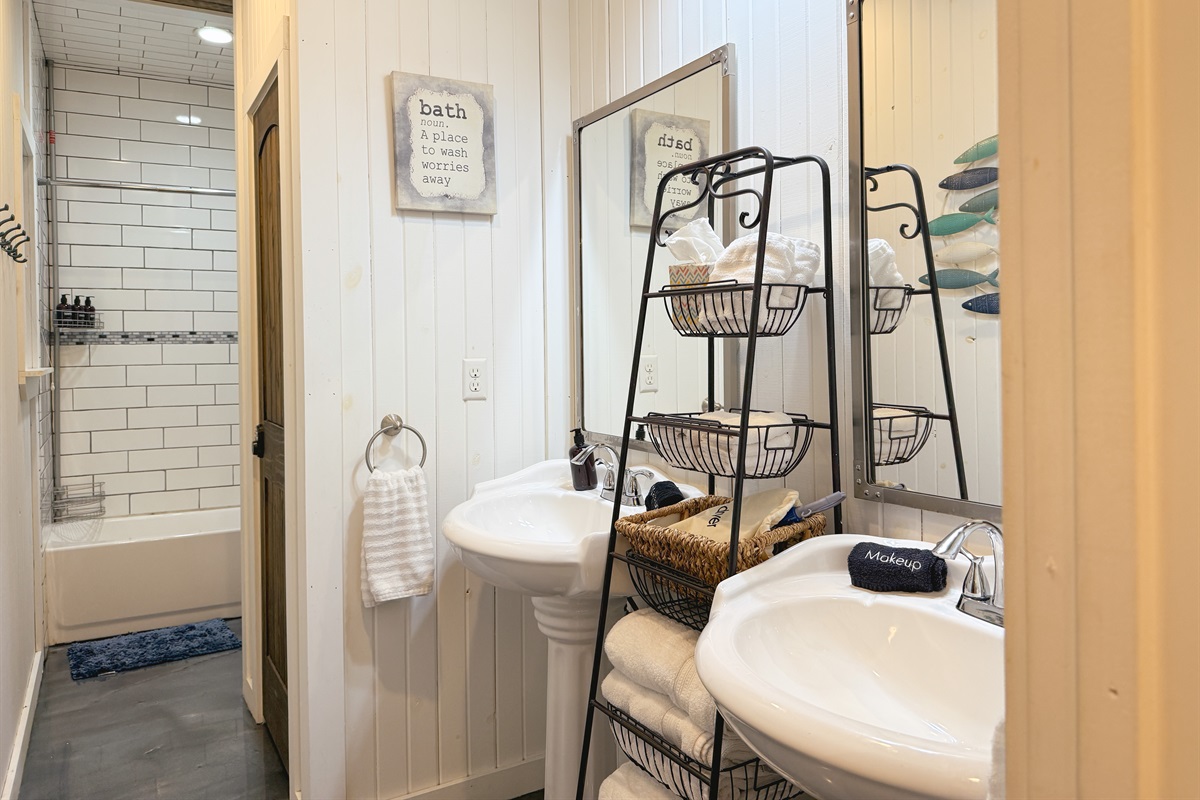 Spacious & stylish with double sinks + fluffy towels.