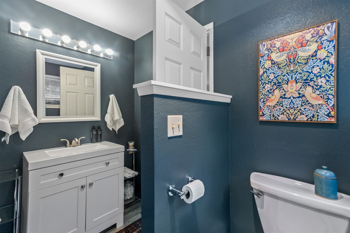 Color-drenched bathroom has artistic touches to help you feel at home.