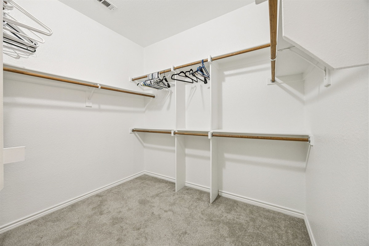 Spacious walk-in closet with room for all your travel essentials.