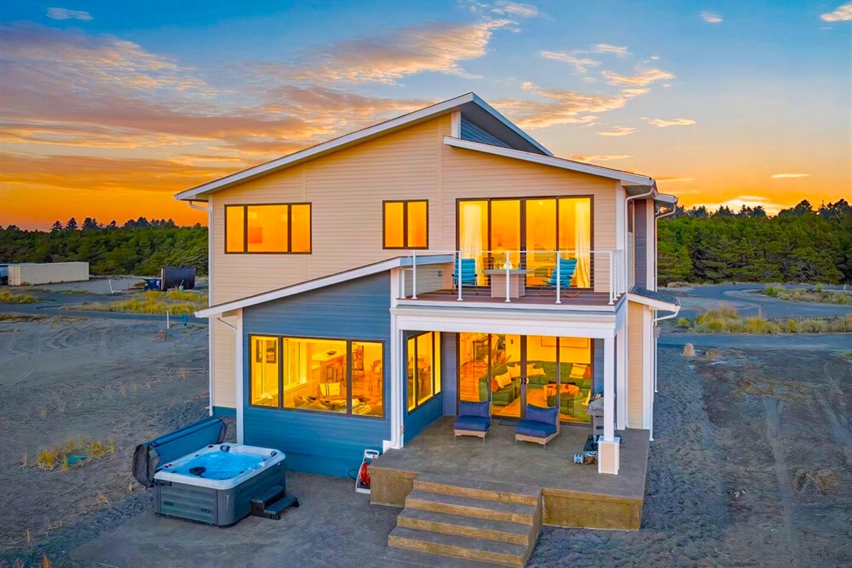 {Back Patio} Patio features ocean views, hot tub, and outdoor seating. 