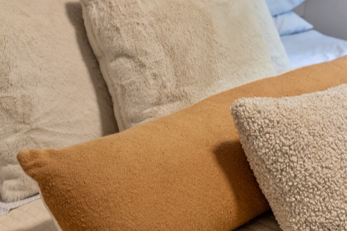 Wrapped in soft linens and plenty of pillows, this king bed is made for relaxation.