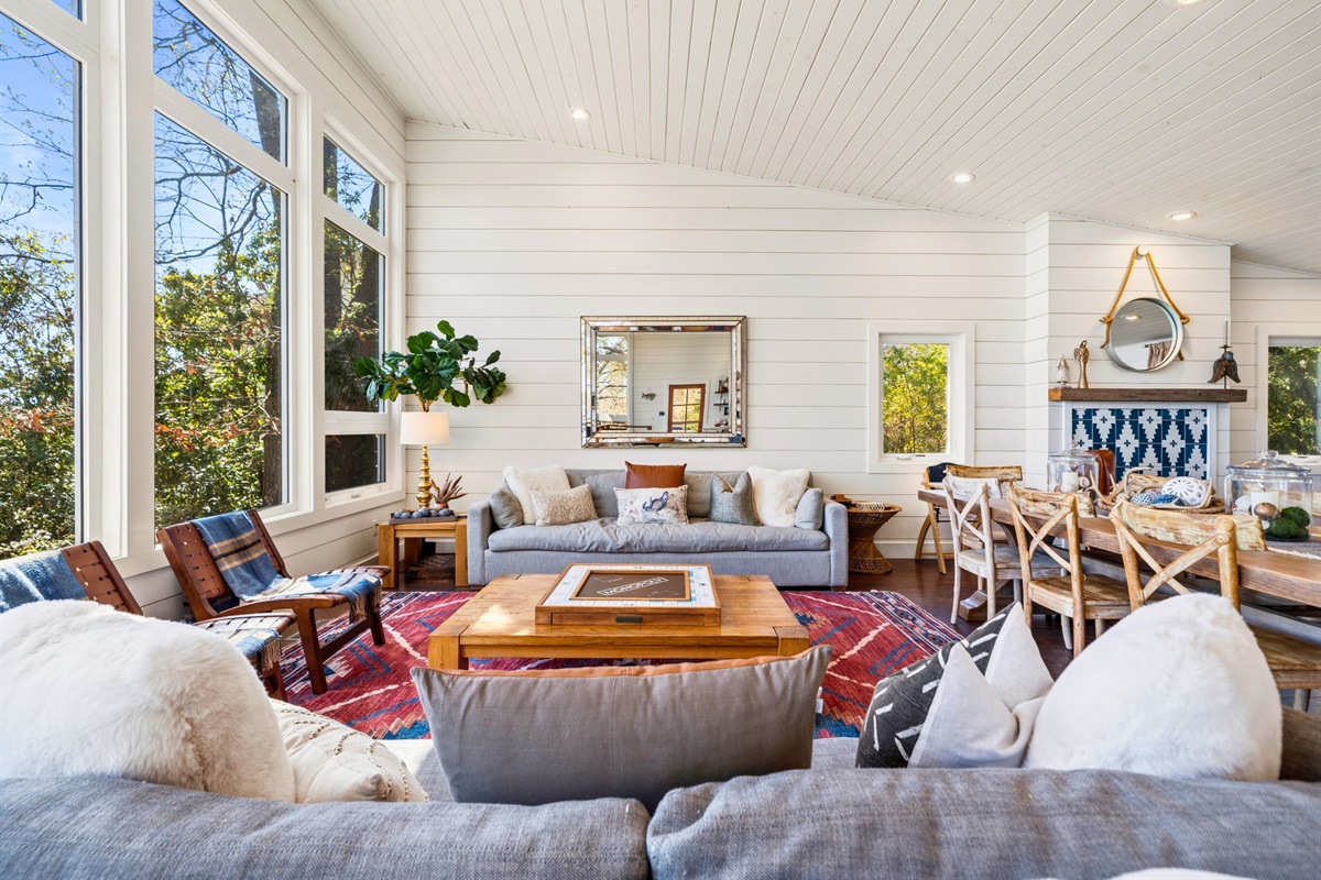 Relax in the spacious living room where large windows bring in natural light and frame the surrounding views.