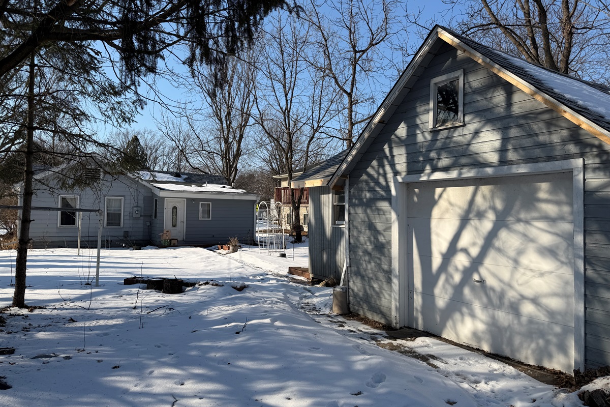You can park in front of the garage door and walk to the backdoor of the house, but the lockbox is by the front door.