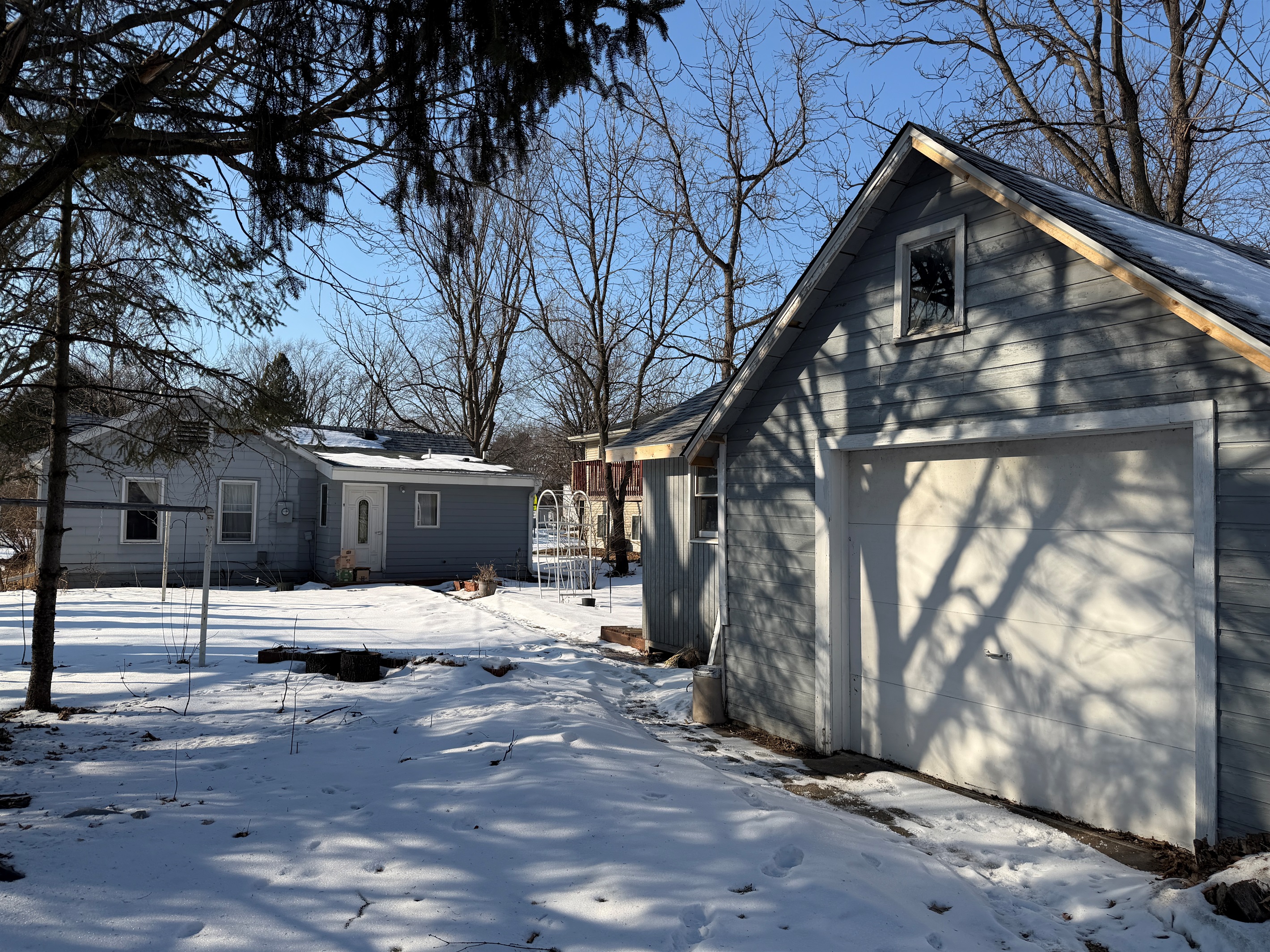 You can park in front of the garage door and walk to the backdoor of the house, but the lockbox is by the front door.