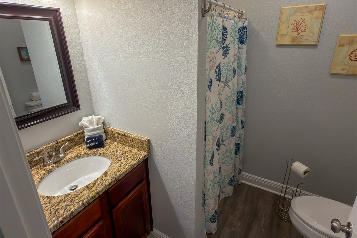 Ensuite Bathroom 5 offers a spacious vanity area and a walk-in shower, ideal for both quick refreshes and relaxing evenings in.