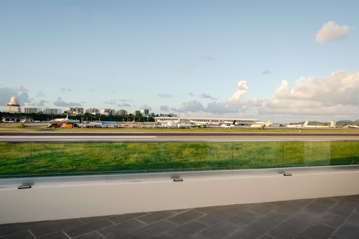 Watch the jets glide in right from your private balcony shared with the other king bedroom