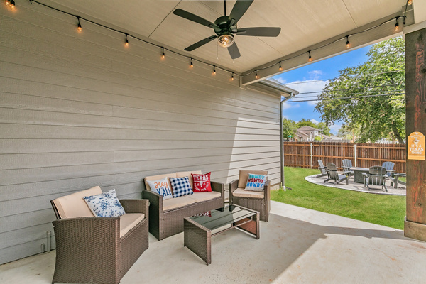 Covered patio with seating and fan