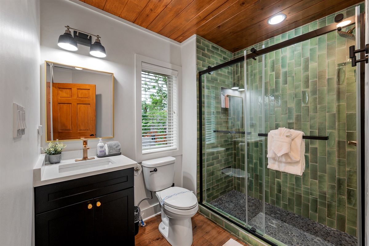 Private bath in upstairs King Bedroom, complete with walk in shower. Get ready for your next adventure in your private ensuite bath. 