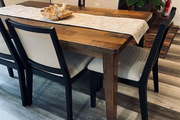 A warm dining space where light and form come together, inviting shared meals and quiet moments around the table.