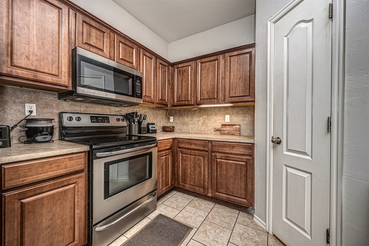 Bright kitchen featuring a cozy table set for four guests.