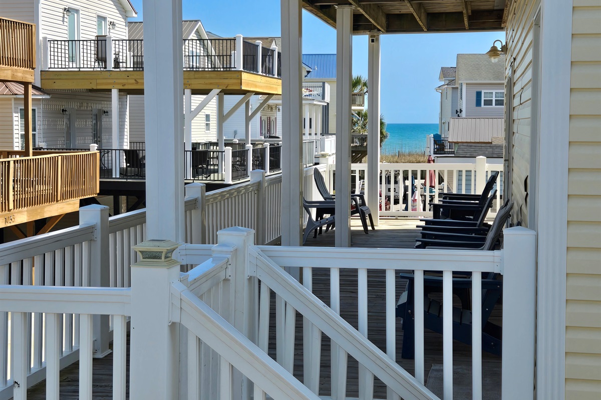 Standing on main balcony, looking accross to ocean (neighbor's balcony in photo)