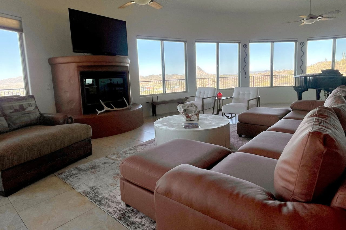 Leather seating and a fireplace make this living room a comfortable spot to unwind together.