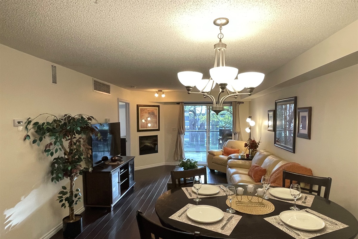 Cozy couch and open concept dining room.