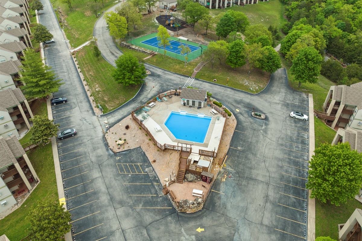 Seasonal pool, hot tub, playground, and sports court all in one easy-to-enjoy resort setting.