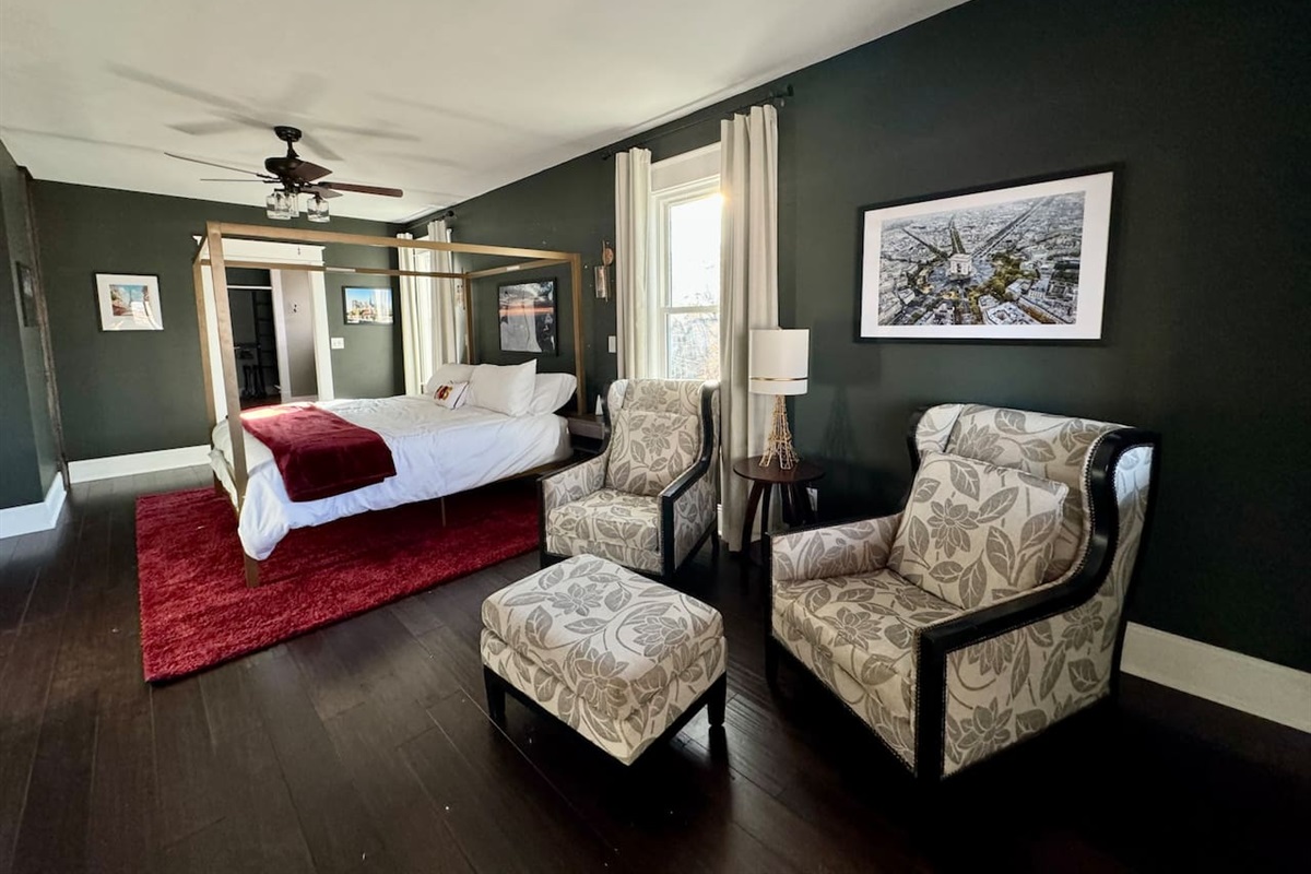 The Upper Level Paris Suite offers a King Bed, sitting area, ensuite bathroom and even partial views of the lake.