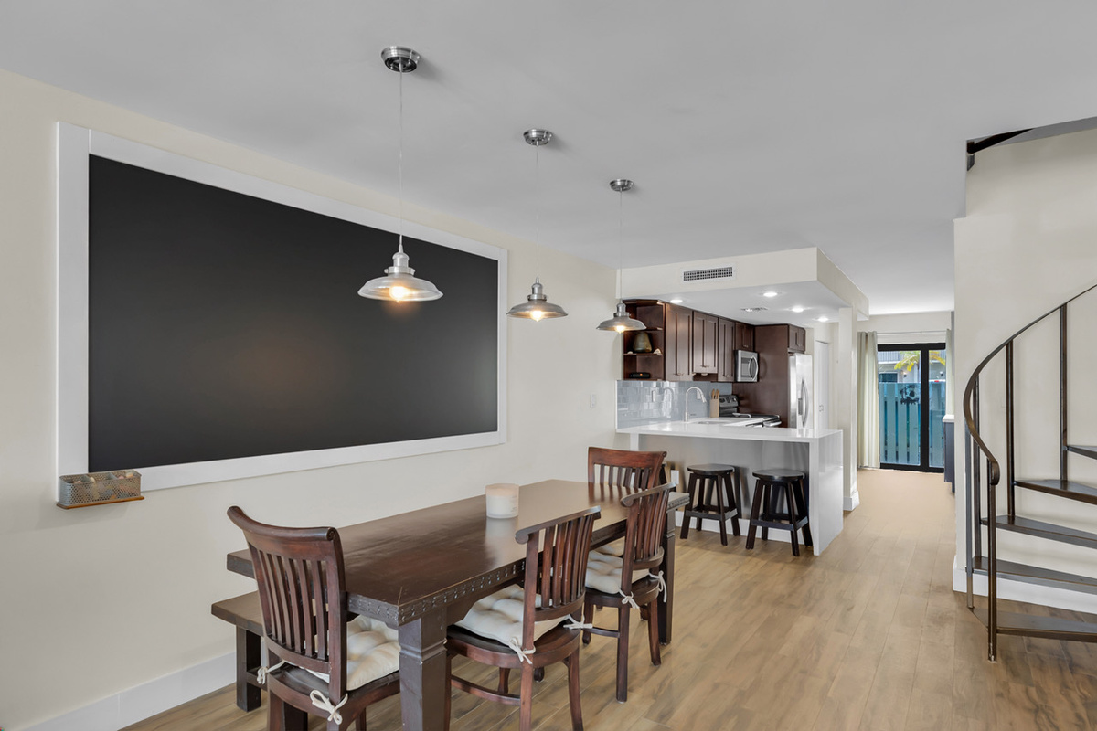 Dining table with additional seating at the kitchen counter 