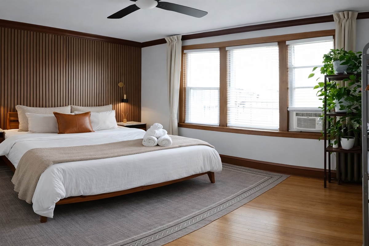 King bed, oversized windows, and quiet work corner — build for deep sleep, bright mornings, and spacious layout, no cramped city bedroom here.