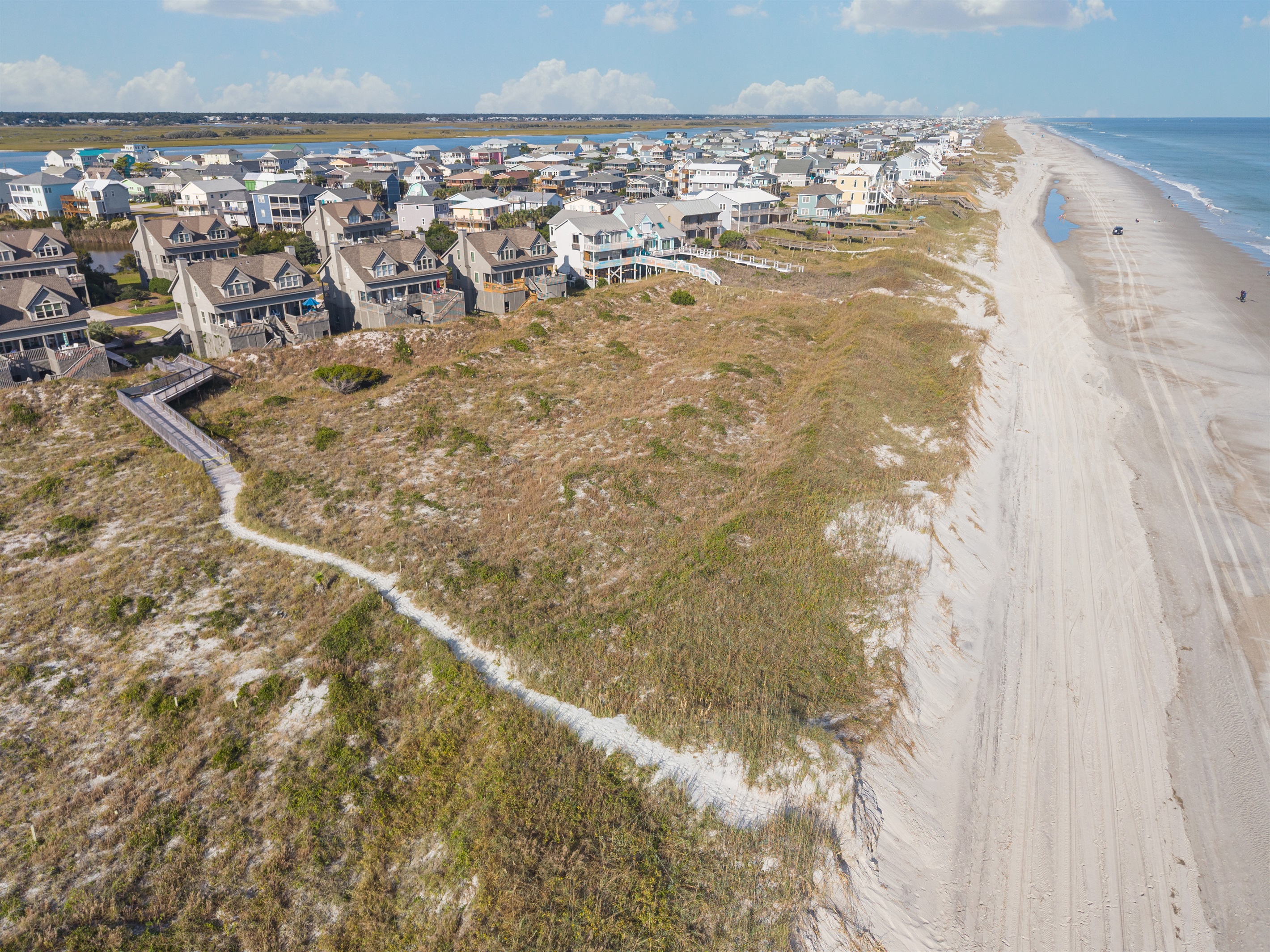 Wide, uncrowded Topsail Beach shoreline just a short stroll away.
