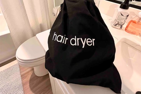 Hair dryers in both bathrooms.