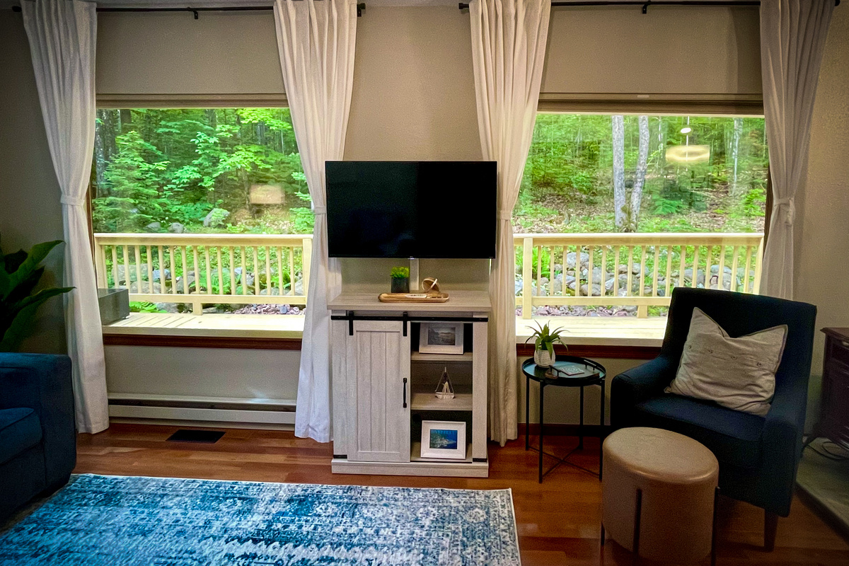 Two huge panoramic mirror reflective double windows view out of living room. You can see out mirror reflective means you can’t see in from outside! 