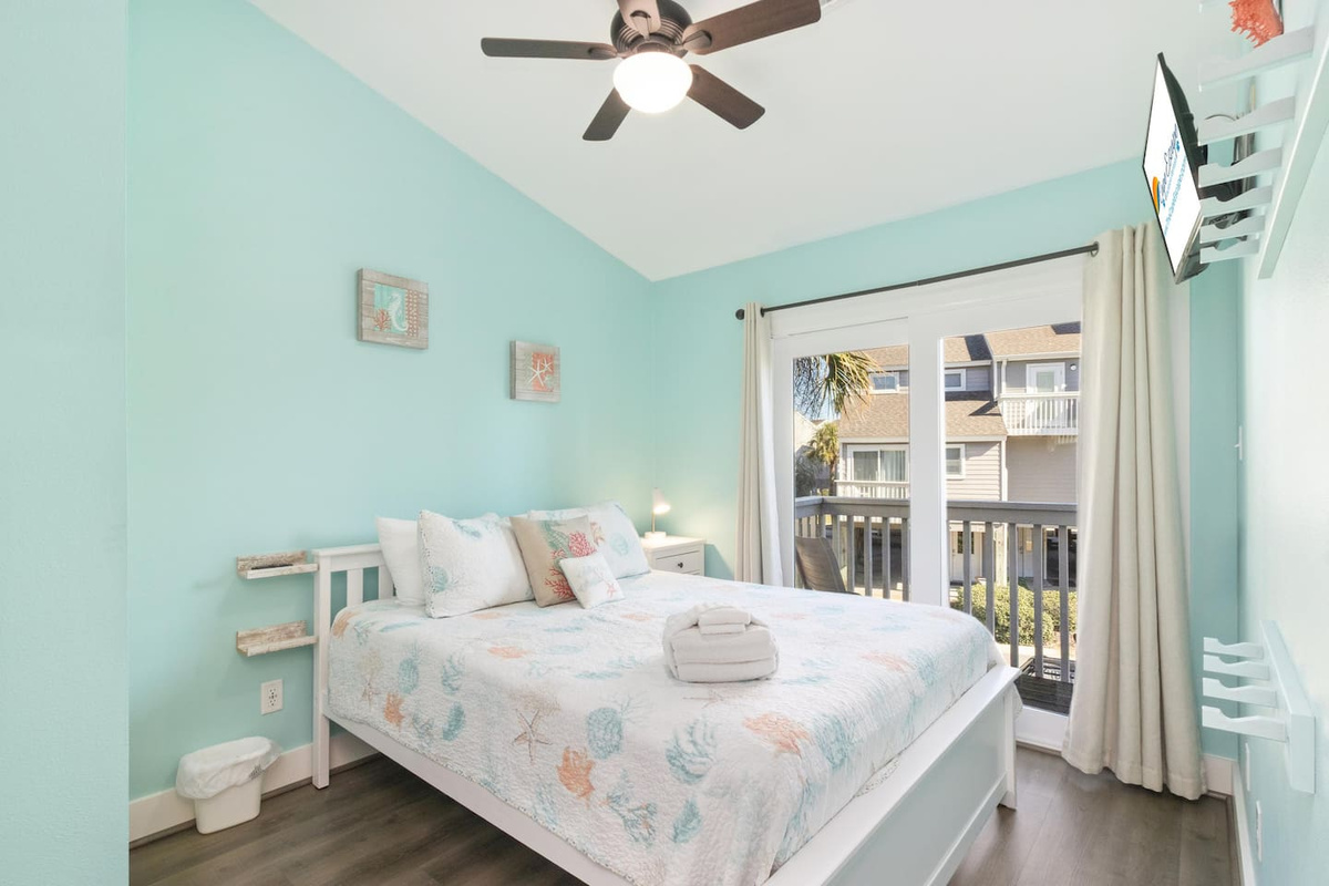 Your main-level queen bedroom comes with deck access and a wall-mounted TV &mdash; a private retreat for the second sleepers.