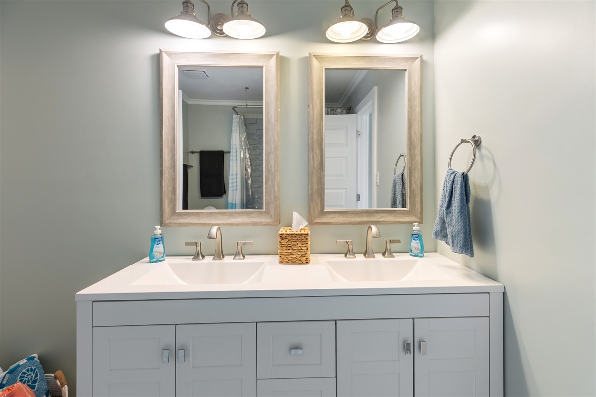 Jack and Jill bathroom connects bedrooms 1 and 4 with a double vanity.