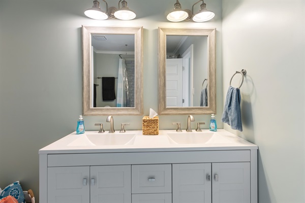 Jack and Jill bathroom connects bedrooms 1 and 4 with a double vanity.