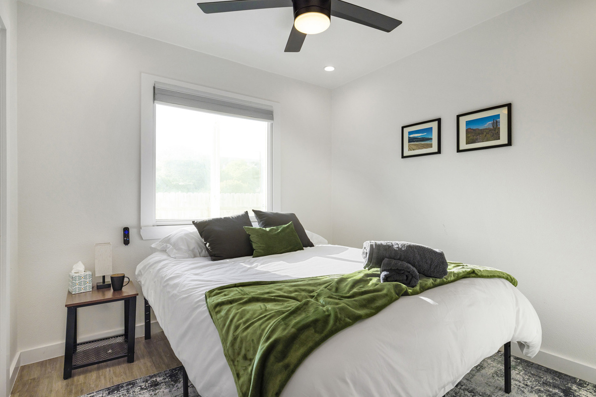 Elegant space with comfy bed, natural light, and stylish decor awaits you!