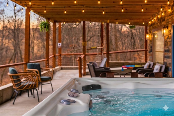 Relax in the hot tub while enjoying the scenic views.