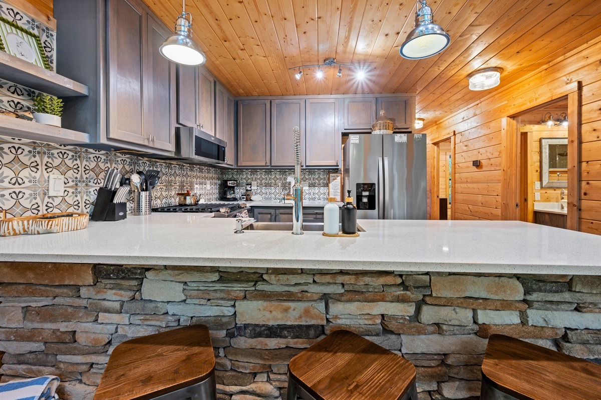 The spacious breakfast bar makes it easy to serve up meals or enjoy a casual snack while staying part of the conversation.