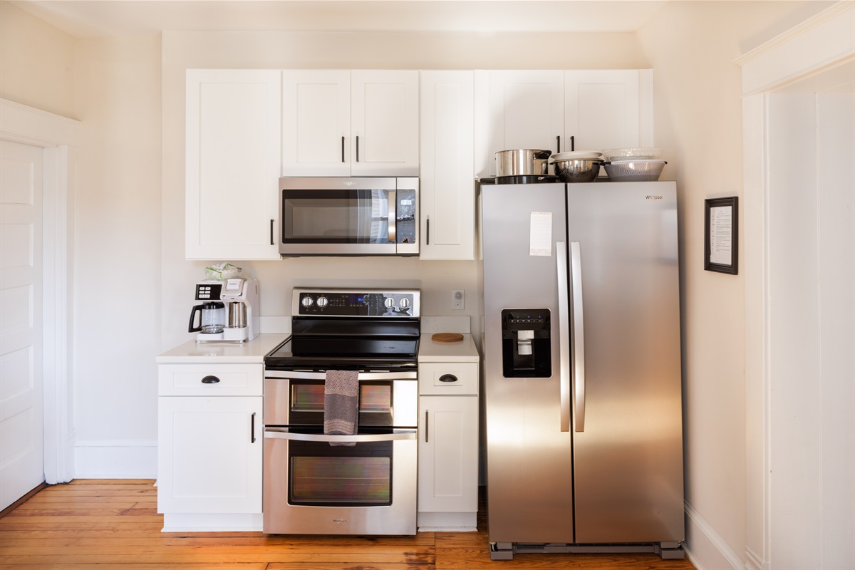 Spacious kitchen with modern appliances, essentials.