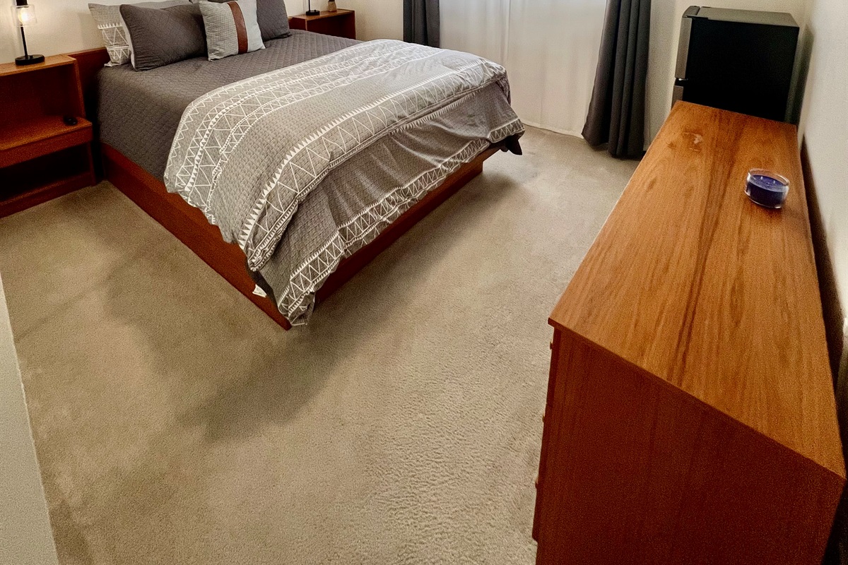 The second guest room, complete with a comfortable Queen bed and a personal Smart TV for streaming.
