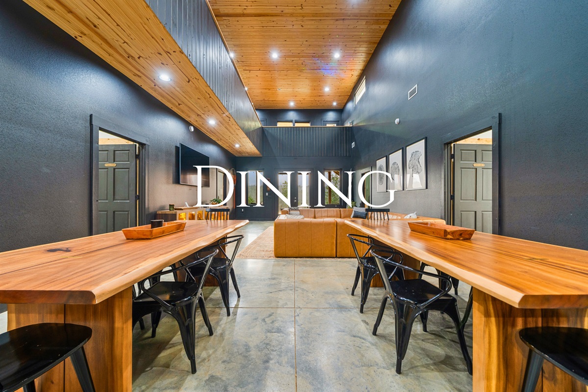 The dining area offers a comfortable and stylish space to gather for meals, celebrations, or a lively game night around the table.