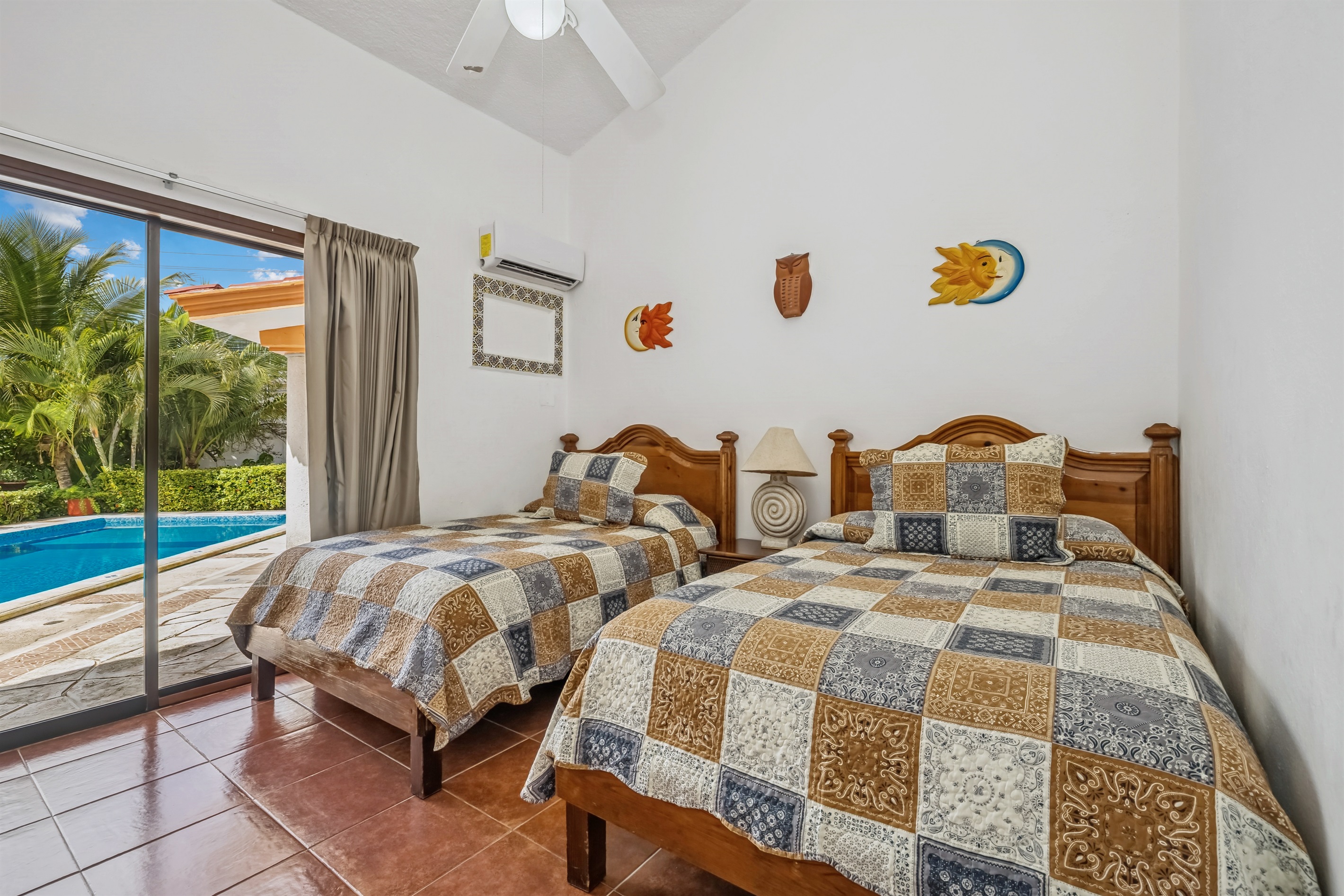 Bedroom 1 on Main Floor with Shared Bathroom and Access to Backyard