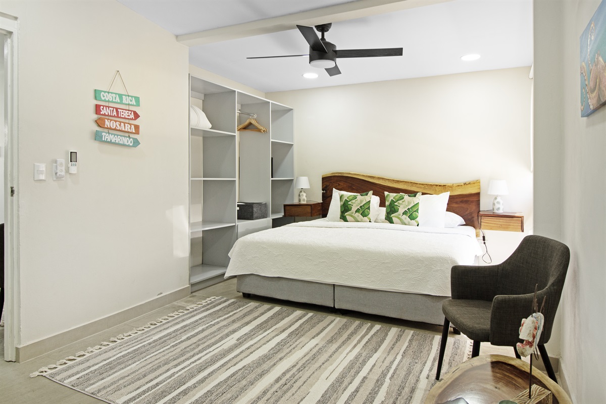 Master bedroom with a king size bed, ensuite bathroom and ample closet space. Choose between air conditioning or ceiling fan for a more natural breeze.